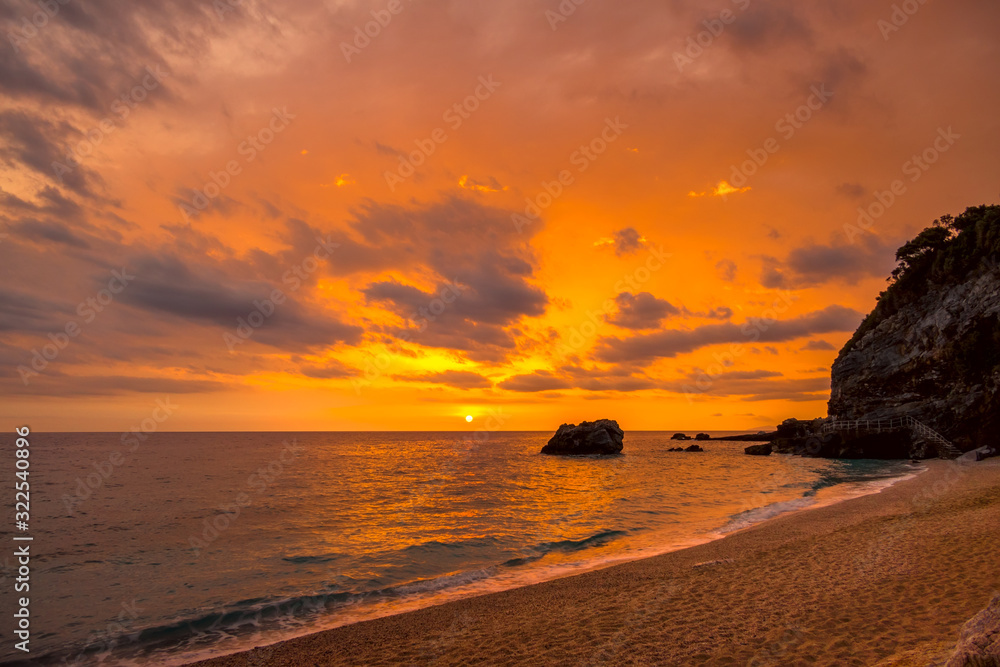 Multicolor Sea Sunrise on a Small Beach