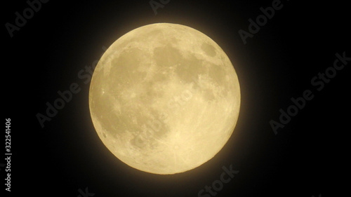 Close-up of the full moon with black background