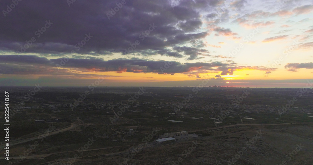 A beautifel panoramic photo of sunrise on the vally. Dramatic clouds. The sun rays.