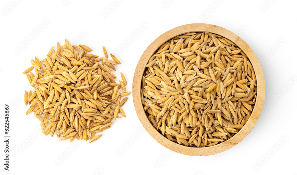 paddy rice seed in wood bowl on white background paddy rice seed in wood bowl on white background