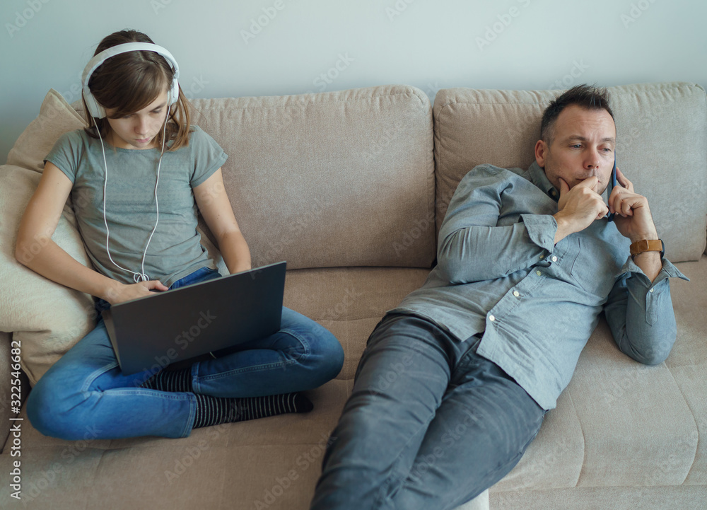 © Space_Cat - Technology addicted family: parents and child use laptop and mobile phones. Modern family values - Mom, dad with daughter obsessed with devices overuse social media, internet addiction concept.