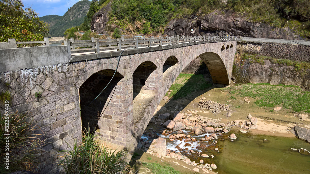Fototapeta premium old stone bridge over the river