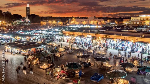 Time lapse of Jamaa el Fna (Jemaa el-Fnaa) in the evening. Marrakesh, Morocco photo