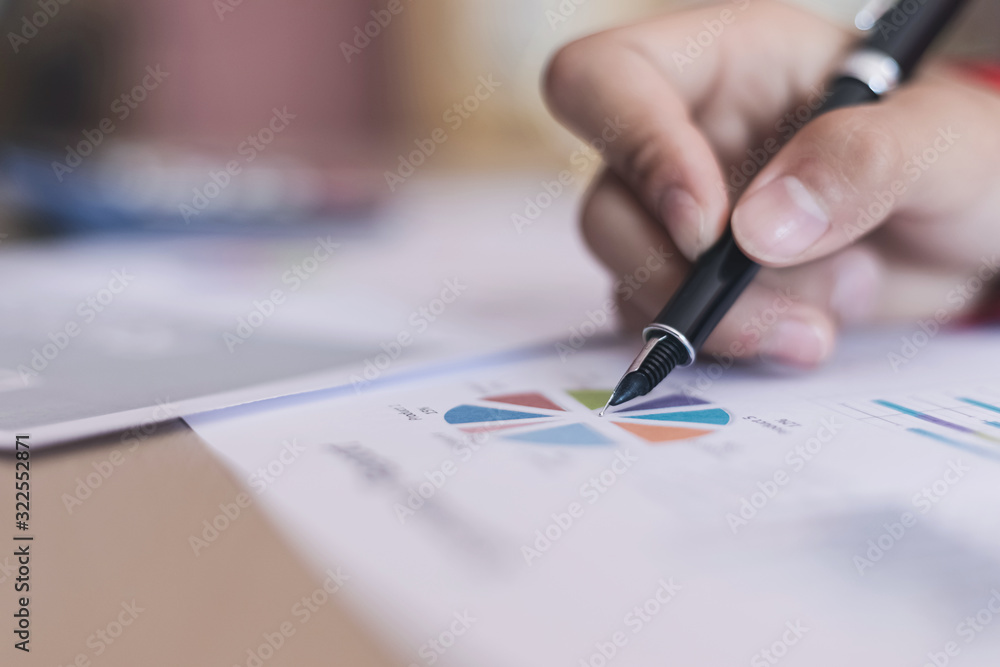 Human hand using pen with report working for business. Human hand using pen with report working for business.