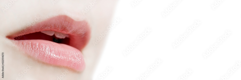 Obraz premium Girl natural lips close up on white panoramic background