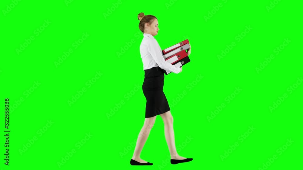 Office Worker Struggles With Carrying Binders Full of Documents Green Screen
