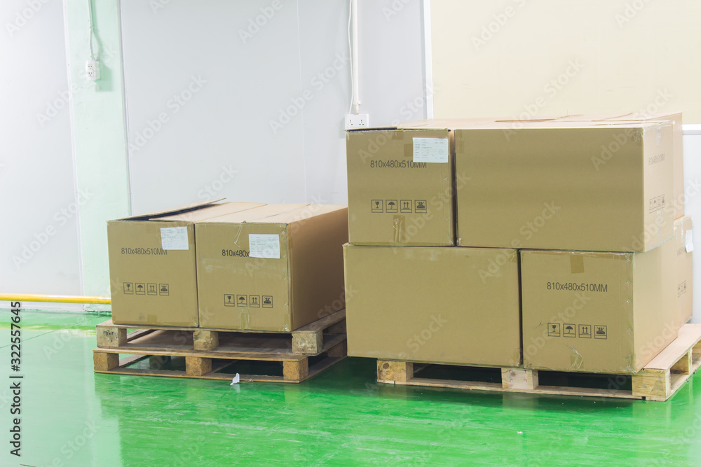 Fototapeta premium The boxes on pallet in the factory. soft focus