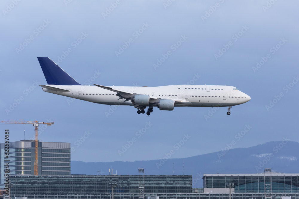 Landing an airplane at a major airport amid urban buildings. Landing an airplane at a major airport amid urban buildings.