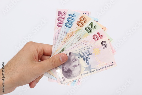 Turkey handful of paper money on a white background