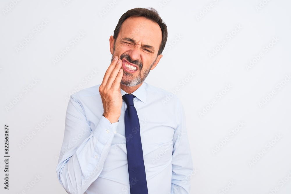 Middle age businessman wearing elegant tie standing over isolated white background touching mouth with hand with painful expression because of toothache or dental illness on teeth. Dentist concept. Middle age businessman wearing elegant tie standing over isolated white background touching mouth with hand with painful expression because of toothache or dental illness on teeth. Dentist concept.