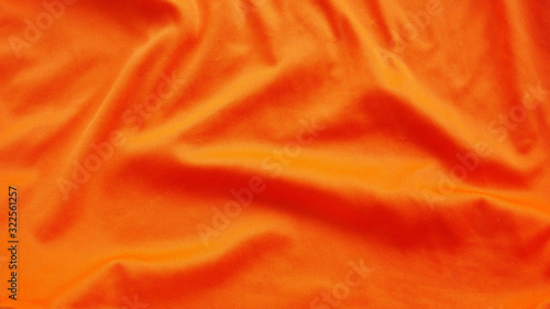 orange silk fabric background. colorful cotton cloth texture