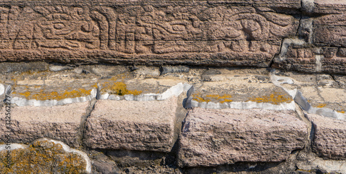 Fragment of Greater Temple (Templo Mayor) Detail of ancient aztec ruins. Travel photo. Structure of old walls. Mexico city. photo