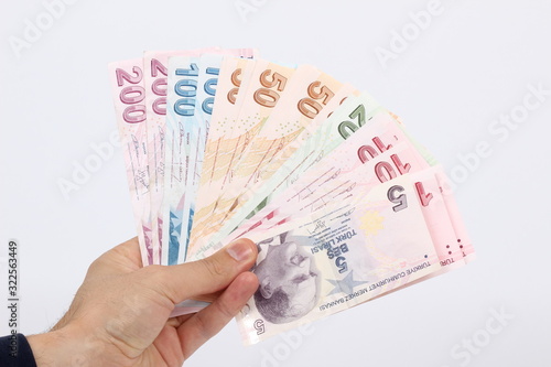 Turkey handful of paper money on a white background