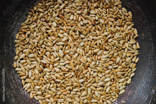 unshelled fried sunflower seeds in bowl