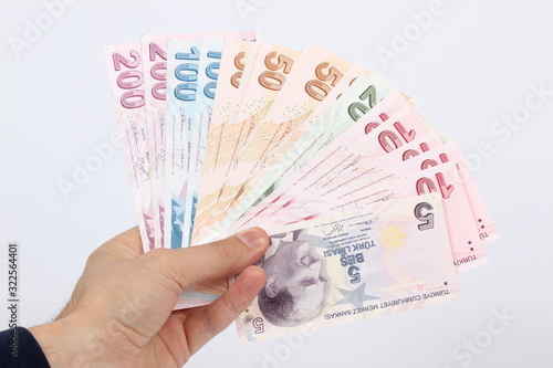 Turkey handful of paper money on a white background