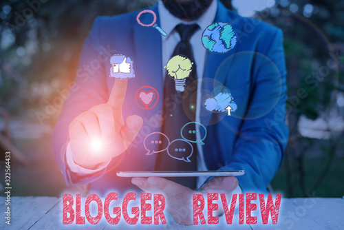 Word writing text Blogger Review. Business photo showcasing making a critical reconsideration and summary of a blog photo
