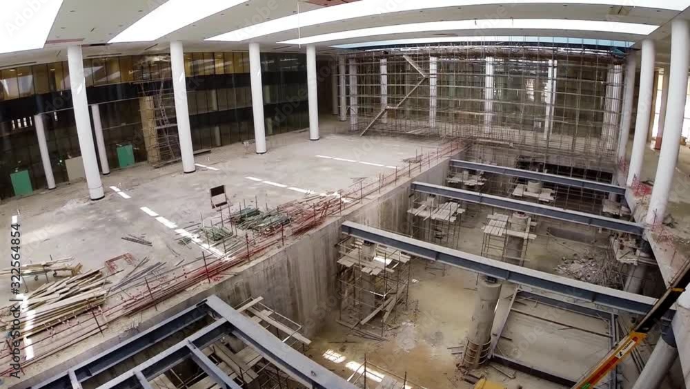 drone view of property development building site form inside close up of steel construction equipment drone view of property development building site form inside close up of steel construction equipment