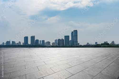 Background material of city and ground synthesis under blue sky and white clouds