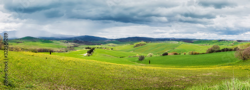Amazing Tuscany landscape with green rolling hills in spring rainy morning © Jess_Ivanova