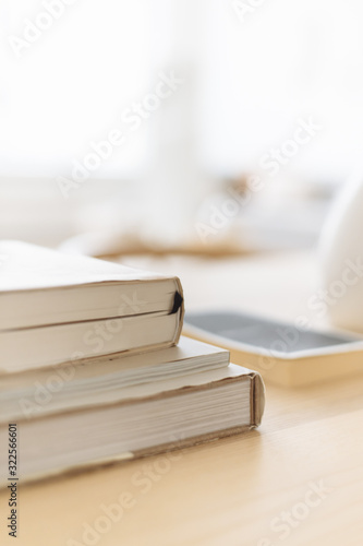 book on wood table white bright interior © Andrey