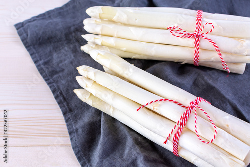 New harvest of white asparagus, two bunches high quality raw asparagus in spring season, ready to cook photo