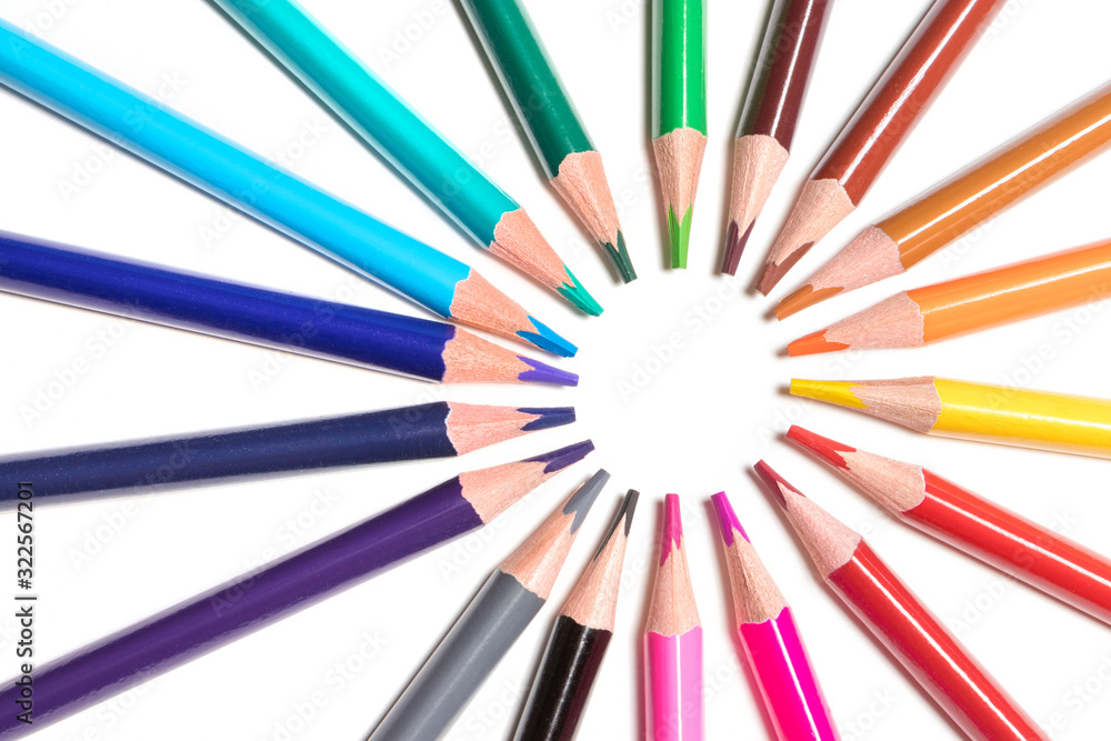 color pencils lie around on a white background