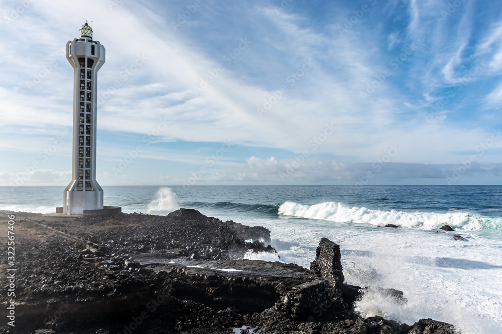 Fototapeta premium Dangerious ocean stormy waves hits black lava rocks by Faro de las Hoyas, La Palma island, Canary, Spain