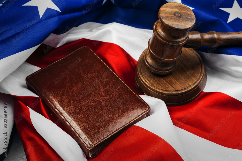 Gavel on wooden table with USA flag