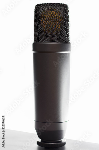 microphone standing in front of white background