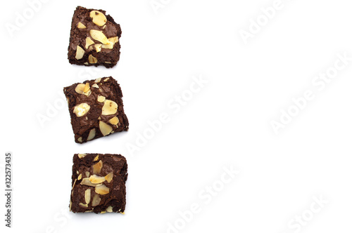 Chocolate brownies with sliced almond nuts toppings isolated on white background and copy space.