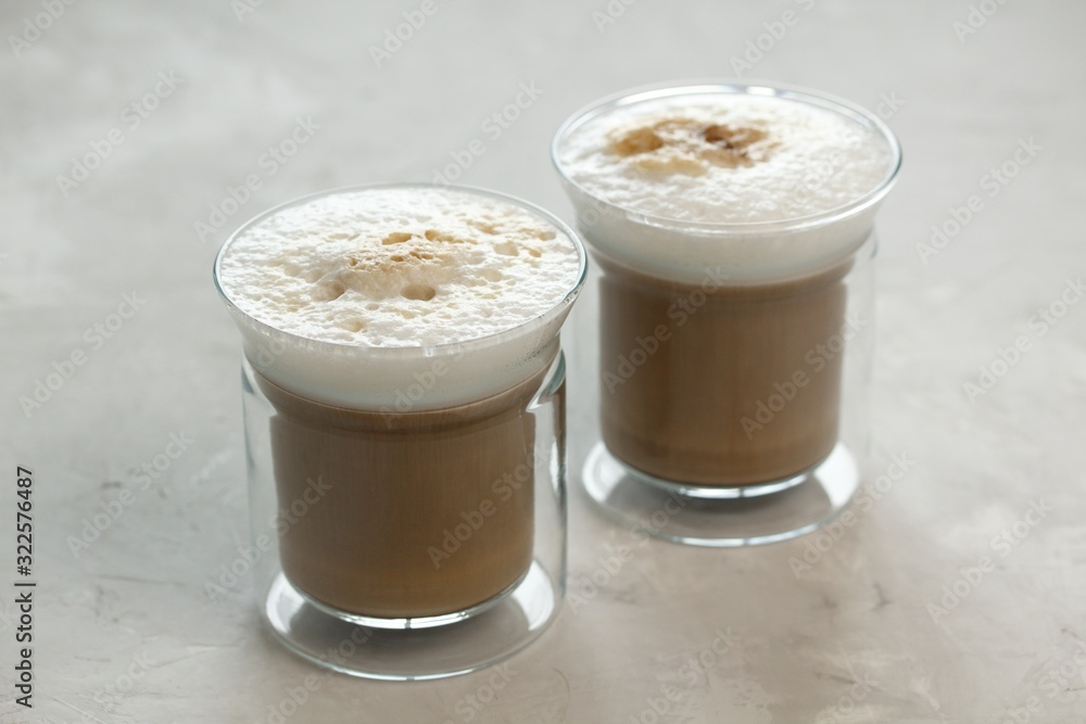 Two glass cups with latte coffee Two glass cups with latte coffee
