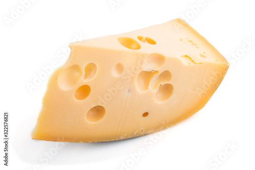 Piece of yellow cheese isolated on white background. Side view.