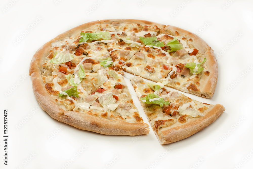 The pizza with chicken and green lettuce