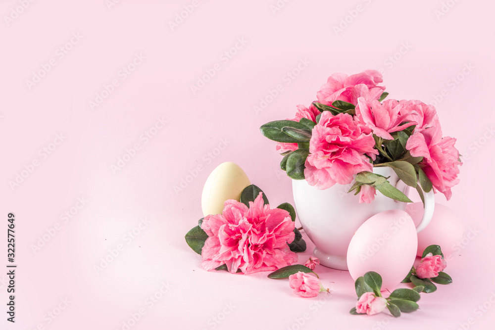 Tender Easter composition with easter eggs and pink spring flower branches Tender Easter composition with easter eggs and pink spring flower branches