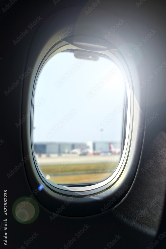 The airplane window is travelling 