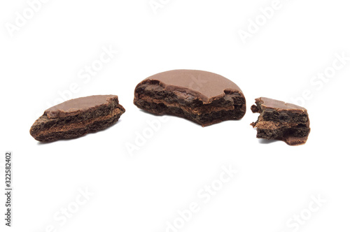 Chocolate sandwich cookies filled and coated with chocolate cream isolated on white background.