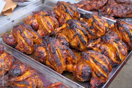 Closeup of grill chicken display for sale at local market 