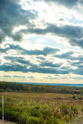 Beautiful clouds in autumn day in the forest near Moscow - nature of Russia.
