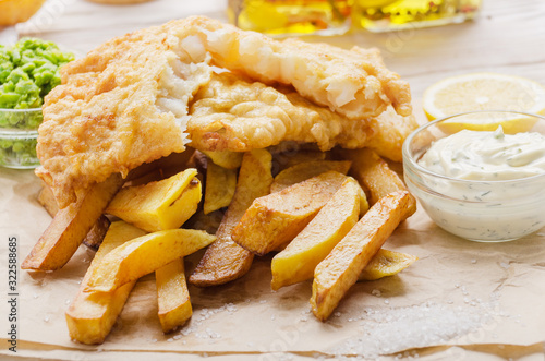 Canvas Print Traditional British street food fish and chips with tartar sauce and mushy peas