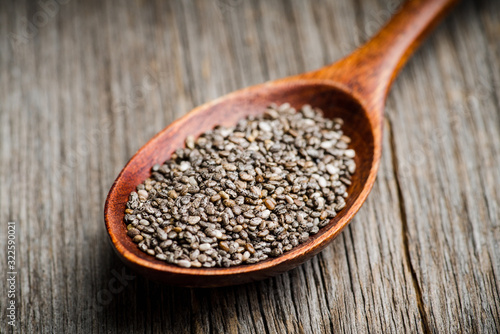 Chia seeds on the wooden table. Selective focus. shallow depth of field.