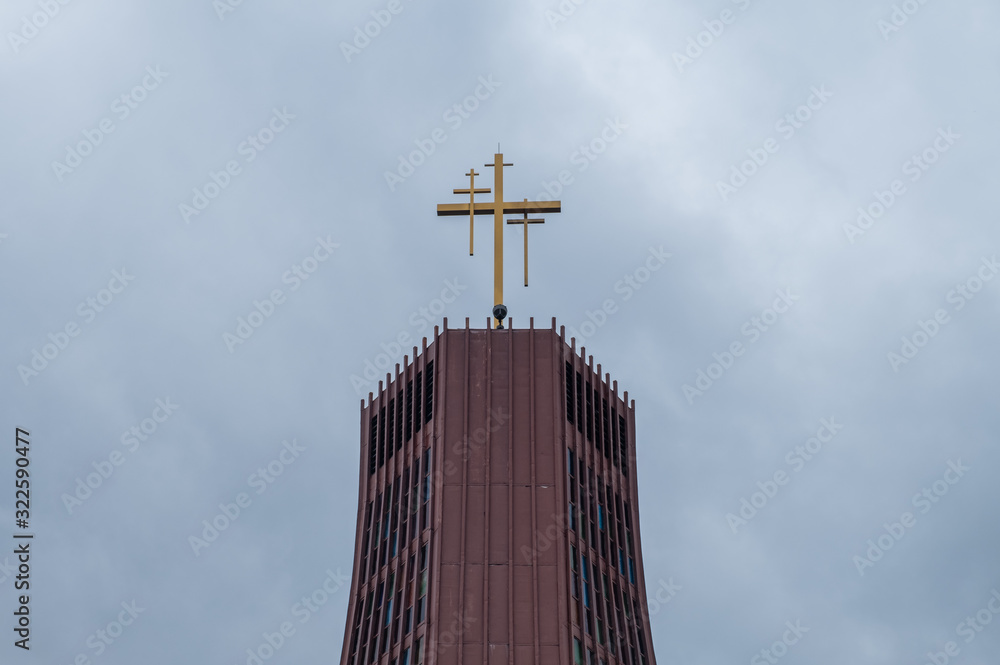 Building roof with church cross. Isolated Jesus cross on top of building roof. 
