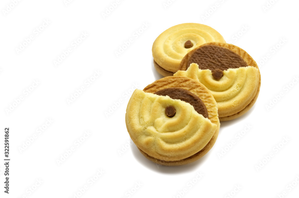 Sandwich cookies filled with coffee cream flavored. Some broken and crumbs of crunchy delicious sweet meal and useful cookie on white background. Sandwich cookies filled with coffee cream flavored. Some broken and crumbs of crunchy delicious sweet meal and useful cookie on white background.
