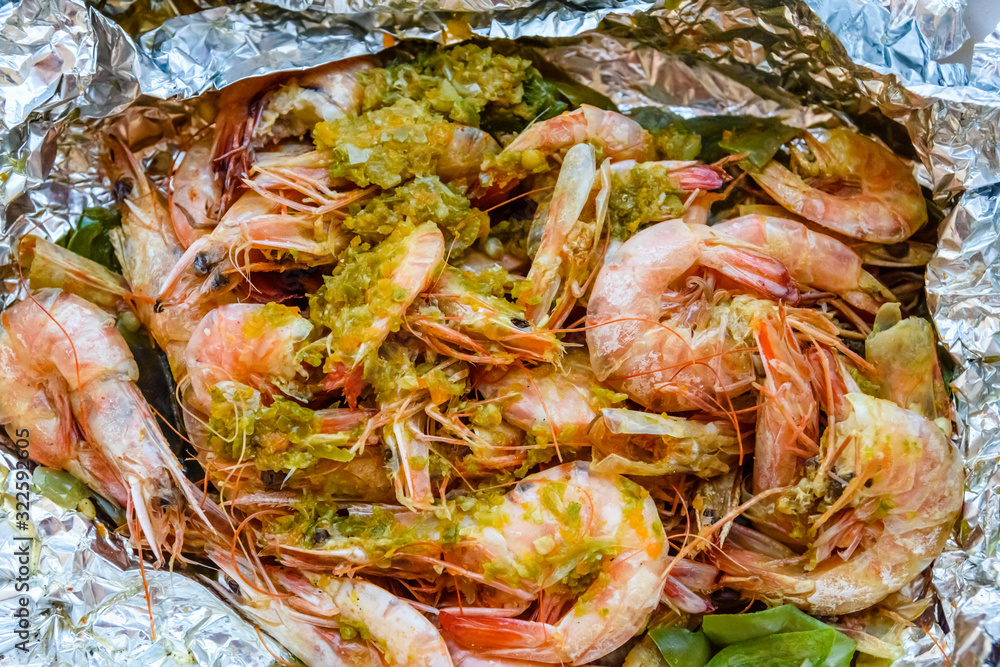 Fresh baked king shrimps with the oriental herbs