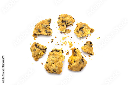 Homemade Oatmeal Raisin Cookies cracked and crumbs isolated on white background.