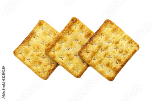 Square crackers biscuits isolated on white background. Crushed dry snack.