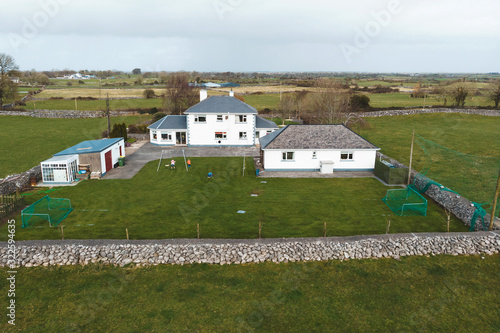 family at yard with houses