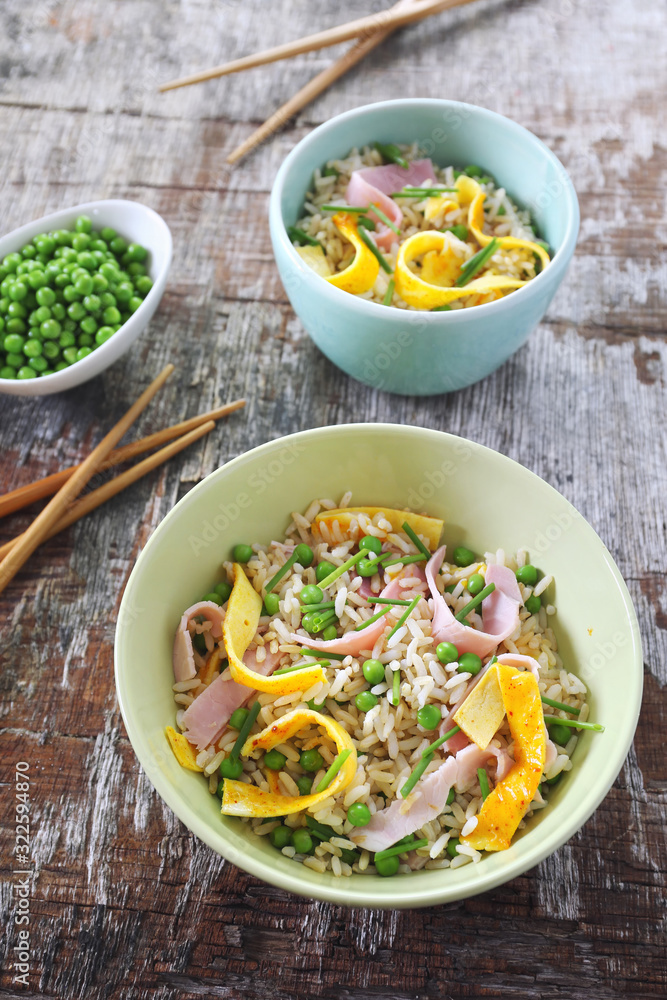 Chinese food. Cantonese fried rice with omelette, green peas and white ham Chinese food. Cantonese fried rice with omelette, green peas and white ham