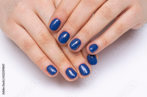 dark blue manicure with crystals on short oval nails. Indigo.
