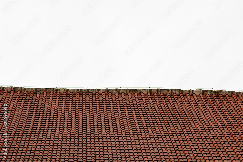Fototapeta premium Prague. 05.10.2019: Low light detail of patina red roof top. Prague Lesser Town typical roofing material. Old roofing of clay tiles. Various orange shades and stains.