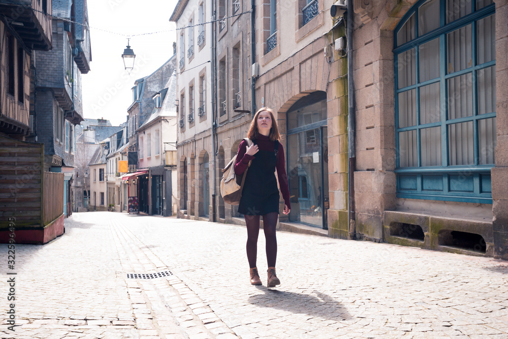 girl is walking in the old town Morlaix girl is walking in the old town Morlaix